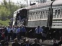 Orthodox priest performs surgical operations on those injured in a train collision near Moscow