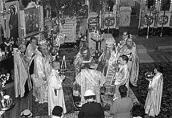 St. John (center) serving the Divine Liturgy at the Convent of the Vladimir Icon of the Theotokos in San Francisco. Concelebrating with him are Bishop Nektary of Seattle (left) and Bishop Sava of Edmonton (right). The author is next to Bishop Sava, holding the trikirion.