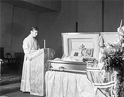Pavel Lukianov reading the Psalter at St. John's coffin.