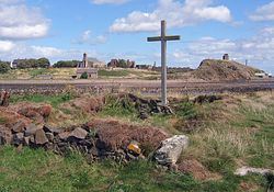 Cross and chapel on St Cuthbert's Isle looking towards Holy Island