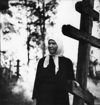 Near a cross, in the 1970s.