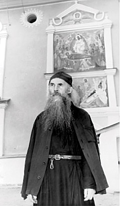 Archimandrite Seraphim (Rosenberg) in front of the Dormition Church, Pskov-Caves Monastery