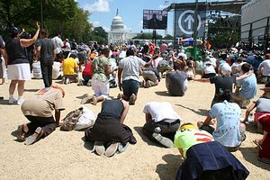 Tens of thousands of people kneel in prayer at TheCall DC on the National Mall, Saturday, Aug. 16, 2008.