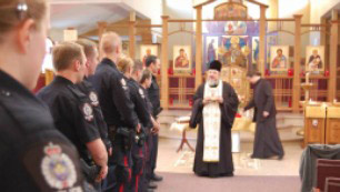 Members of Squadron 8 of the Edmonton Police Service are honoured at St. Herman's Orthodox Church in Edmonton after recovering relics belonging to Vladimir the Great.