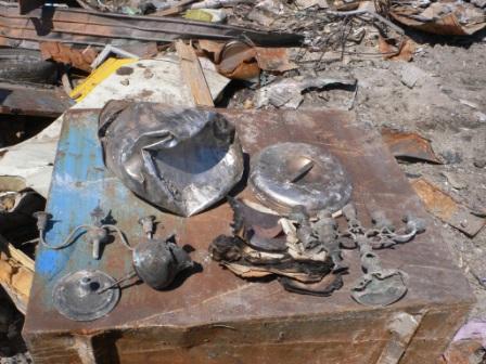 Yamada, church vessels and utensils found amidst the ashes.
