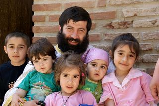 A priest and his children in Bodby, Georgia