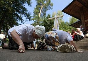 Pilgrims move on their knees at the Holy Hill of Grabarka August 18, 2011/Peter Andrews