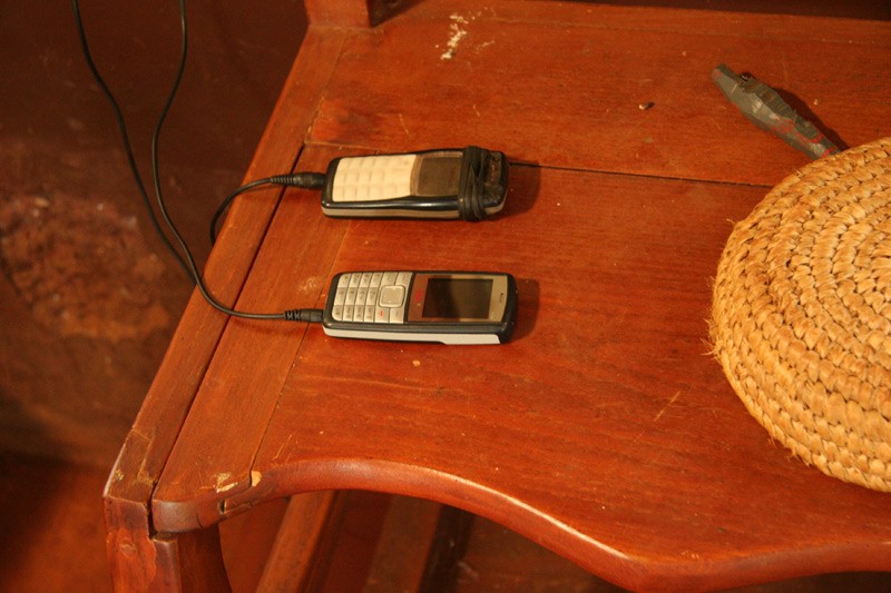 Hope for the Kikuyu.  Parishioners who do not have electricity at home bring their mobile phones to church for a charging.  Photo: Denis Makhanko 