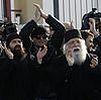 What is behind Greek abbot’s arrest?
