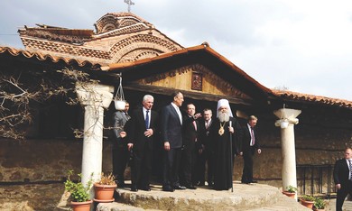 MACEDONIAN ARCHBISHOP in front of church
