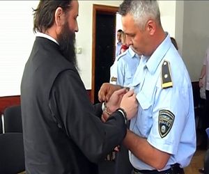 Archbishop Jovan being handcuffed in May, 2012.