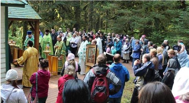 In this Wednesday, Aug. 8, 2012 photo, pilgrims gather at the chapel of Saints Sergius and Herman of Valaam on Spruce Island, Alaska, on the 42nd anniversary of the canonization of St. Herman of Alaska. / AP