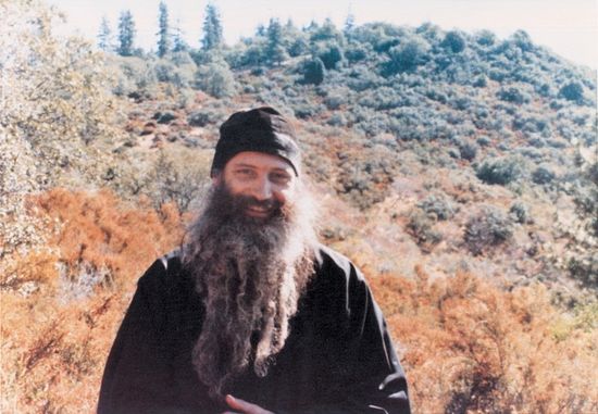Fr. Seraphim in the St. Elias Skete, Noble Ridge, near the St. Herman of Alaska Monastery in Platina, Cal. In the background is Mt. St. Herman.