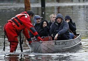 (Photo: Reuters) Residents are rescued by emergency personnel from flood waters brought on by Hurricane Sandy in Little Ferry, N.J.