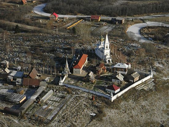 The monastery with the cemetery on the hilltop.