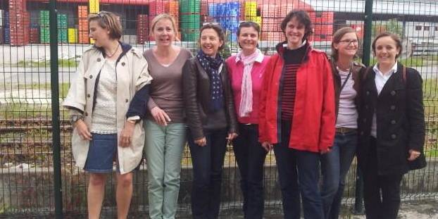 7 mothers in the courtyard of a police station after they were arrested for approaching a public high school in Paris where Hollande came to speak Monday afternoon. 