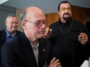 Rep. Dana Rohrabacher, left, who is leading a U.S. Congressional delegation to the Russian Federation, Rep. Steven Cohen, center, and U.S. actor Steven Seagal, right, speak to the media after a news conference in U.S. Embassy in Moscow. (Photo: Alexander Zemlianichenko, AP)