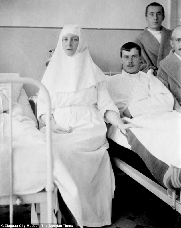 Tsarina Alexandra is seen on a hospital visit to injured servicemen.