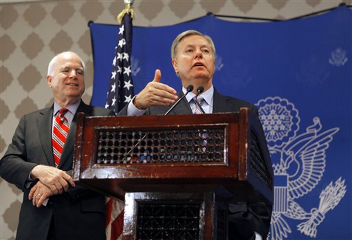 U.S. Sens. John McCain, left, and Lindsey Graham, speak to reporters in Cairo. (AP)