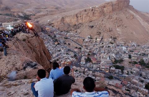 In this Wednesday, Sept. 13, 2006 file photo, thousands of Syrians, most of them Christians, celebrate the Christian Day of the Cross, by setting a fire on top of a mountain in the village of Maaloula, north of Damascus. (AP Photo Bassem Tellawi)