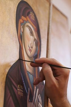 Iconographer Filip Subotic puts the finishing touches on the icon wall at St. Demetrius Serbian Orthodox Church in Copley Twp. Photo: Phil Masturzo/Akron Beacon Journal