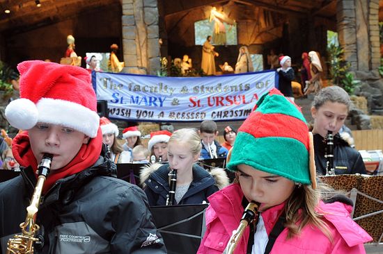 Luke Szafranski and Anna Norman perform in the bands from St. Mary of the Assumption in Glenshaw and St. Ursula in Hampton at the dedication of the Pittsburgh Creche at the U.S. Steel Tower plaza, Downtown, on Friday. Photo: Pam Panchak/Post-Gazette