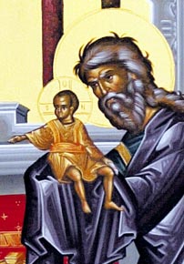 Simeon took Jesus in his arms and praised God.