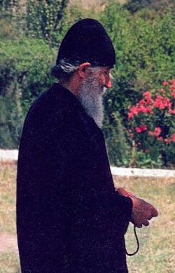 Elder Paisios walking in a garden