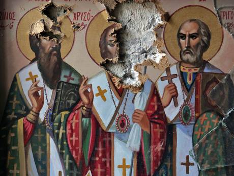 Damaged icons inside the church of the monastery of Saint Takla in the ancient Christian town of Maalula, 56km from Damascus (Getty)