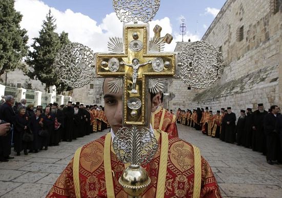 Orthodox clergy take part in the Christmas procession outside the Church of the Nativity in the West Bank town of Bethlehem, Jan. 6, 2011. Reuters