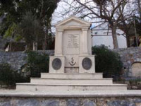 Monument with the bust of Papa Lefteris Noufrakis in Alones