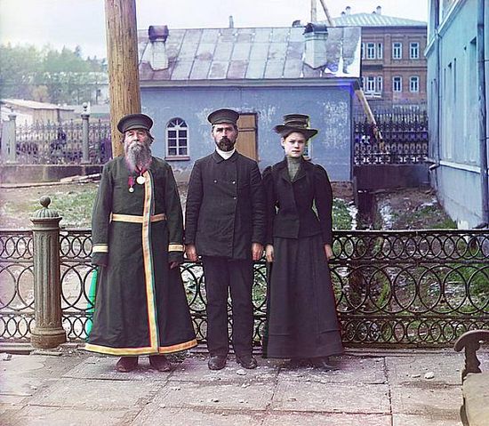 Two men and a woman standing outside the Zlatoust arms plant - 1910