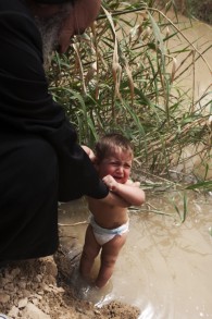 A child is baptized on Orthodox Easter at the Qasr-al-Yahud site on April 14, 2009. (Matanya Tausig/Flash 90)