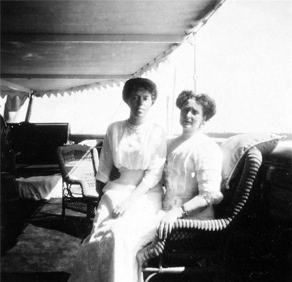 Grand Duchess Olga Alexandrova seated with the Emphress Alexandra