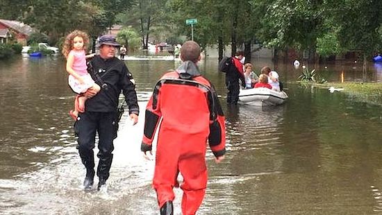  Firefighters rescue a child from floodwaters–a scene that has been repeated hundreds of times since devastating floods swept across South Carolina this weekend. IOCC is in contact with Orthodox Church communities in South Carolina and has called on members of the IOCC Emergency Response Network who live in the affected area to prepare to respond as the needs emerge. Photo: City of North Charleston