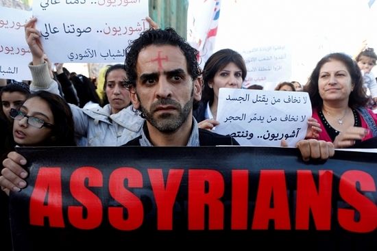 Assyrians hold banners as they march in solidarity with the Assyrians abducted by Islamic State fighters in Syria earlier this week, in Beirut, Lebanon, February 28, 2015. Militants in northeast Syria are now estimated to have abducted at least 220 Assyrian Christians this week, a group monitoring the war reported. The banner (R) reads, "We are not afraid of whom kills the flesh, we are not afraid of who destroys the stone. Assyrians and victorious."