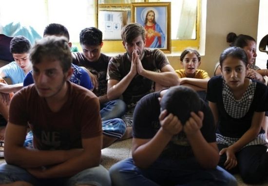 Displaced Iraq Christians who fled from Islamic State militants in Mosul, pray at a school acting as a refugee camp in Erbil September 6, 2014. Read more at http://www.christianpost.com/news/christian-population-in-iraq-in-danger-of-being-eradicated-in-5-years-147947/#AD1g12TtC1clWDDm.99
