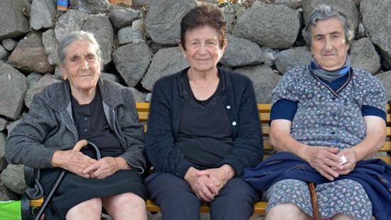 Constantina Mesisklis, center, and two friends at Skala Sykaminia in Lesbos, Greece.