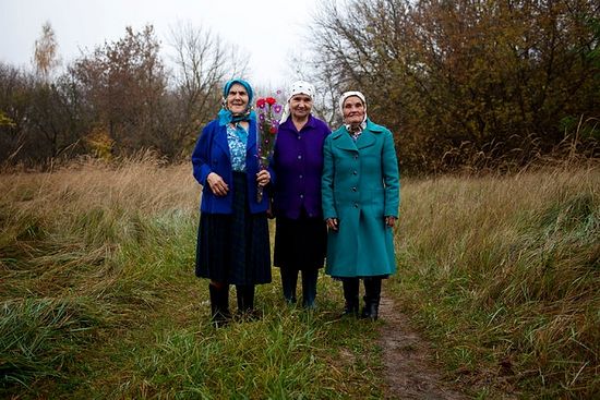 From left, Hanna Zavorotnya, Maria Zagorna and Maria Shovkuta are among the women who chose to return to the Chernobyl exclusion zone after the 1986 nuclear accident. Credit Yuli Solsken