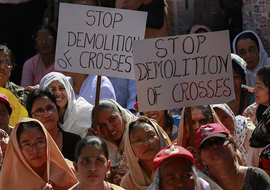 Protesters hold placards during a rally by hundreds of Christians against recent attacks on churches nationwide, in Mumbai, India, February 9, 2015. Five churches in the Indian capital New Delhi have reported incidents of arson, vandalism and burglary. The latest was reported last week when an individual stole ceremonial items.