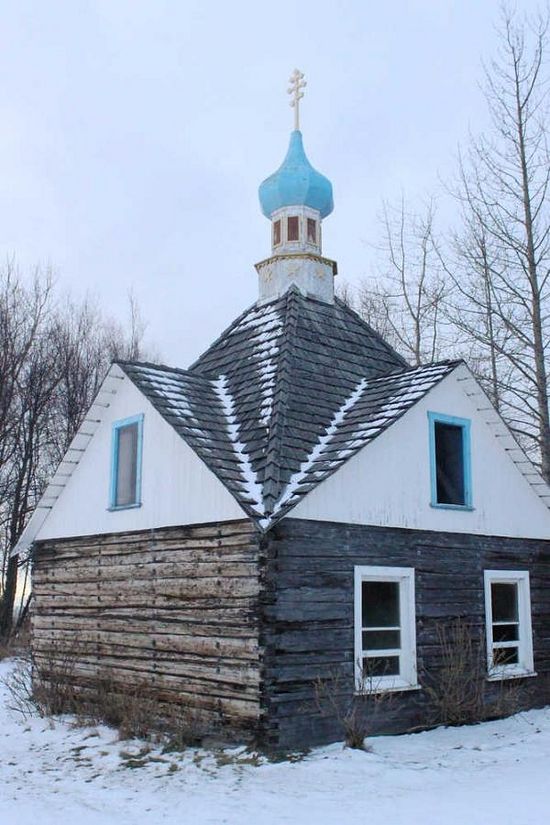 St. Nicholas Chapel stands across the street from Holy Assumption of the Virgin Mary Russian Orthodox church on Sunday, Dec. 20 in Old Town Kenai. The wooden chapel will be 110 years old in 2016. Photo by Ben Boettger/Peninsula Clarion Photo by Ben Boettger/Peninsula Clarion St. Nicholas Chapel stands across the street from Holy Assumption of the Virgin Mary Russian Orthodox church on Sunday, Dec. 20 in Old Town Kenai. The wooden chapel will be 110 years old in 2016.