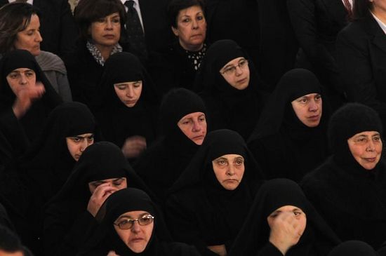 Nuns attend a mass prayer for Orthodox Patriarch of Antioch and All the East Ignatius Hazim IV at the Orthodox Patriarchate in Damascus, Syria, Dec. 10, 2012.PHOTO: KHALED AL-HARIRI/REUTERS