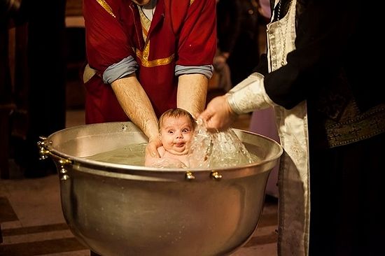 A child being baptized in accordance with the Orthodox tradition. Photo by Nino Alavidze/Agenda.ge