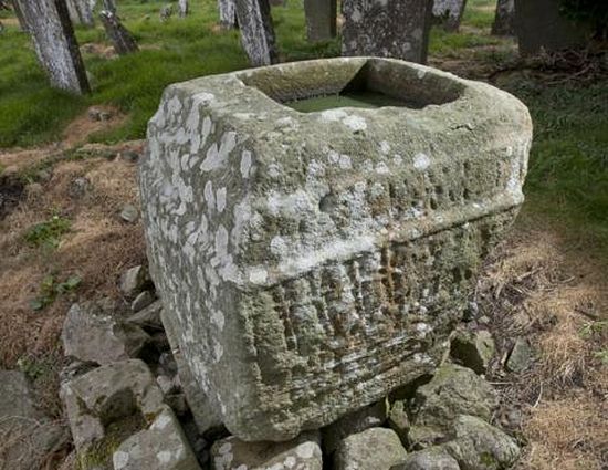 The base of the Celtic cross on the territory of Saighir Monastery