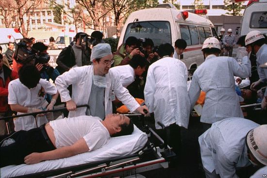 Subway passengers affected by sarin gas spread in the central Tokyo subways by the Aum Shinrikyo doomsday cult are carried into St. Luke's International Hospital in Tokyo, March 20, 1995. The Japanese cult was popular in Russia in the 1990s but was outlawed.