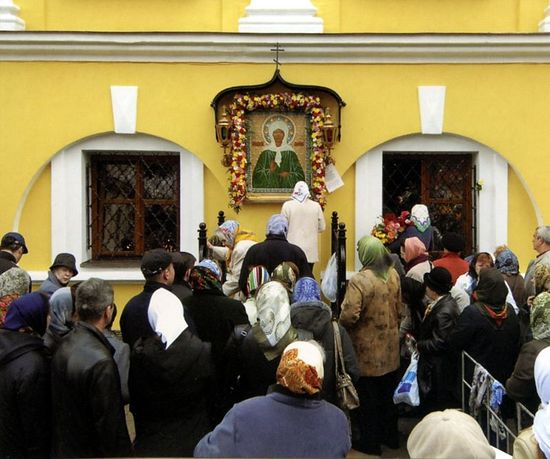 Before an icon of Blessed Matrona of Moscow at the Protection Convent.