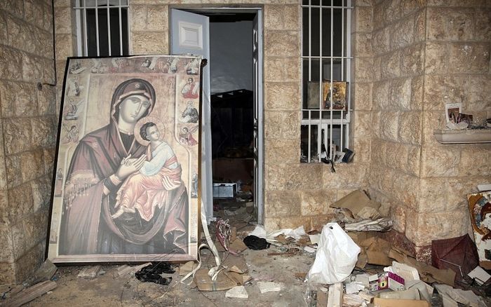 A painting of Mary and the Christ Child is is seen in 2014 at the damaged St Thecla Orthodox monastery in the predominantly Christian town of Maaloula, Syria (CNS photo/Youssef Badawi, EPA)
