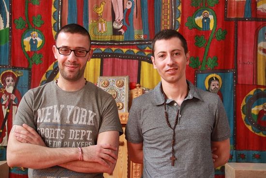 Tarek Bakhous (l) and Wassim Awad, two Syrian Christian refugees, in the Syriac Orthodox Church of Antiochia in Berlin, where the liturgy is in Syriac, a dialect of Aramaic. Credit: Daniel Estrin