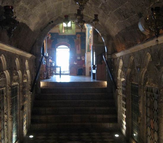 The photo shows a view from the spring towards the entrance to the church.