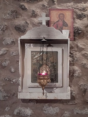 A lamp is kept lit in the Monastery bakery before an icon of the Virgin Mary of the Burning Bush.